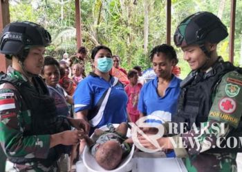 Berikan Kemudahan Masyarakat Peroleh Pelayanan Kesehatan, Satgas Yonif 310/KK Gelar Posyandu